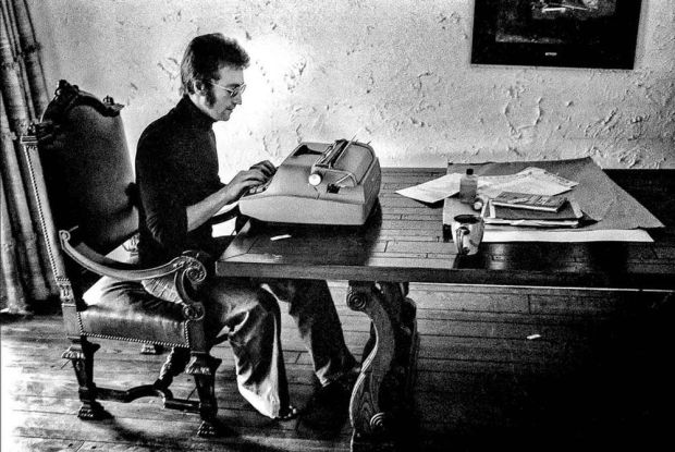 John Lennon typing